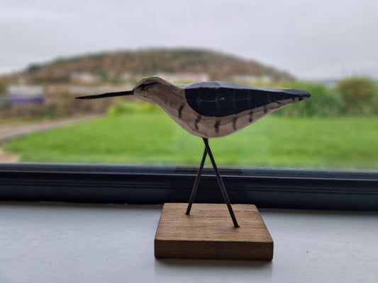 Sandpiper. Wood on metal stand