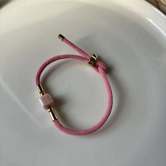 OE DADI - rope bracelet with central ceramic nut. Pink. Handmade in Italy.